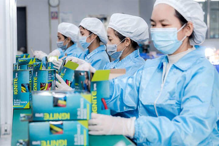 a team of workers are packaging products