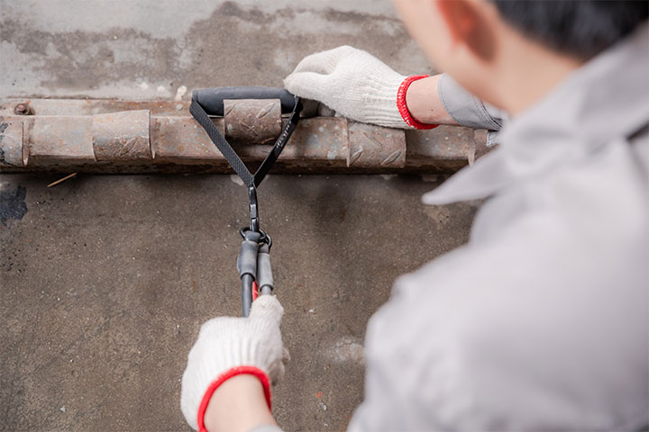 a worker is testing the product's tensity